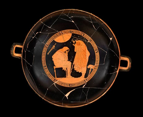 The interior of a red cup showing Achilles and Odysseus. 