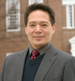A professional headshot of Dr. Peter Tse.