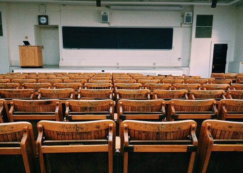 empty brown chairs in a lecture hall